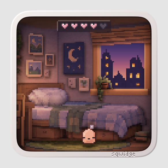 In the evening: a sunset over the town, a moon poster and pictures on the wall, the lamps on.